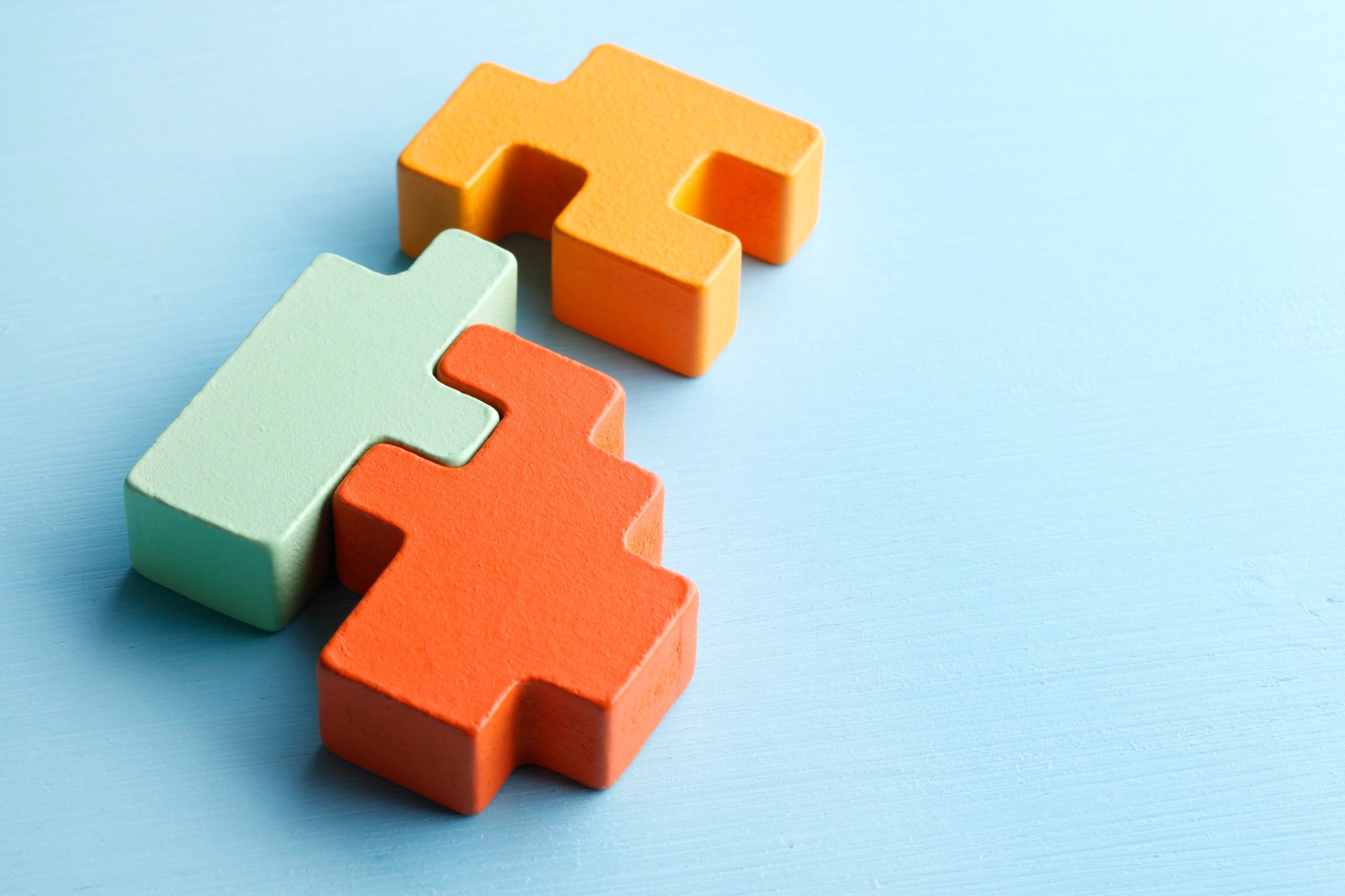 Colorful connected wooden puzzle blocks