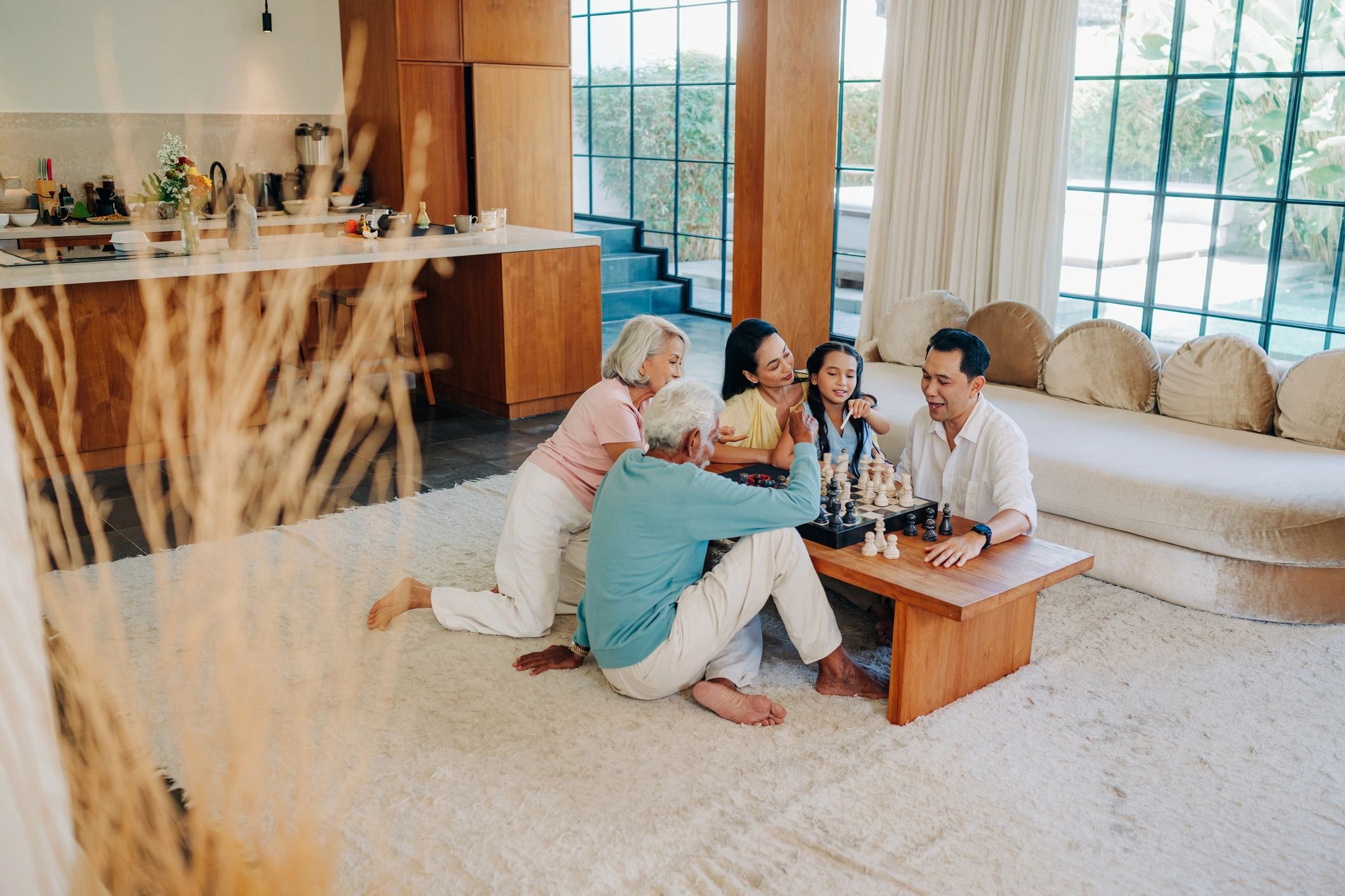 Family enjoying a chess game